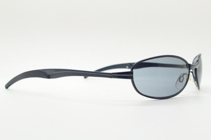 90s vintage oval small bug eye sunglasses. Curved grey satin finish solid metal frame. Rave. Steampunk. Unused NOS