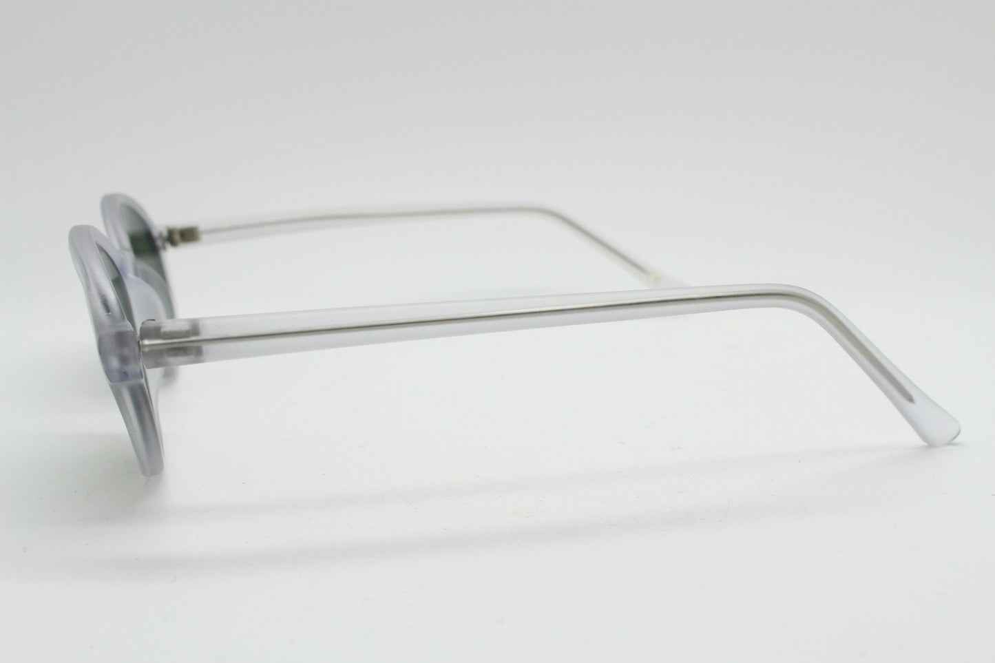 Vintage 90s futuristic oval sunglasses. Frosted transparent frame cat eye with dark green lenses. Unused NOS