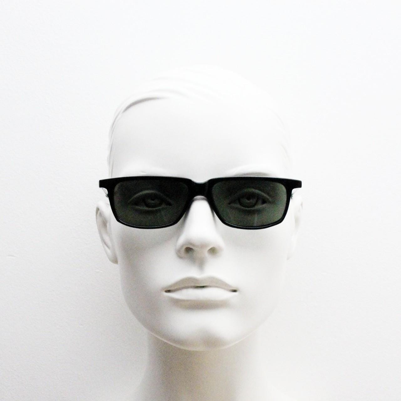 Global Eyewear vintage 90s vintage rectangular low profile sunglasses model 4330. Black flat top frame with silver chrome arms. NOS