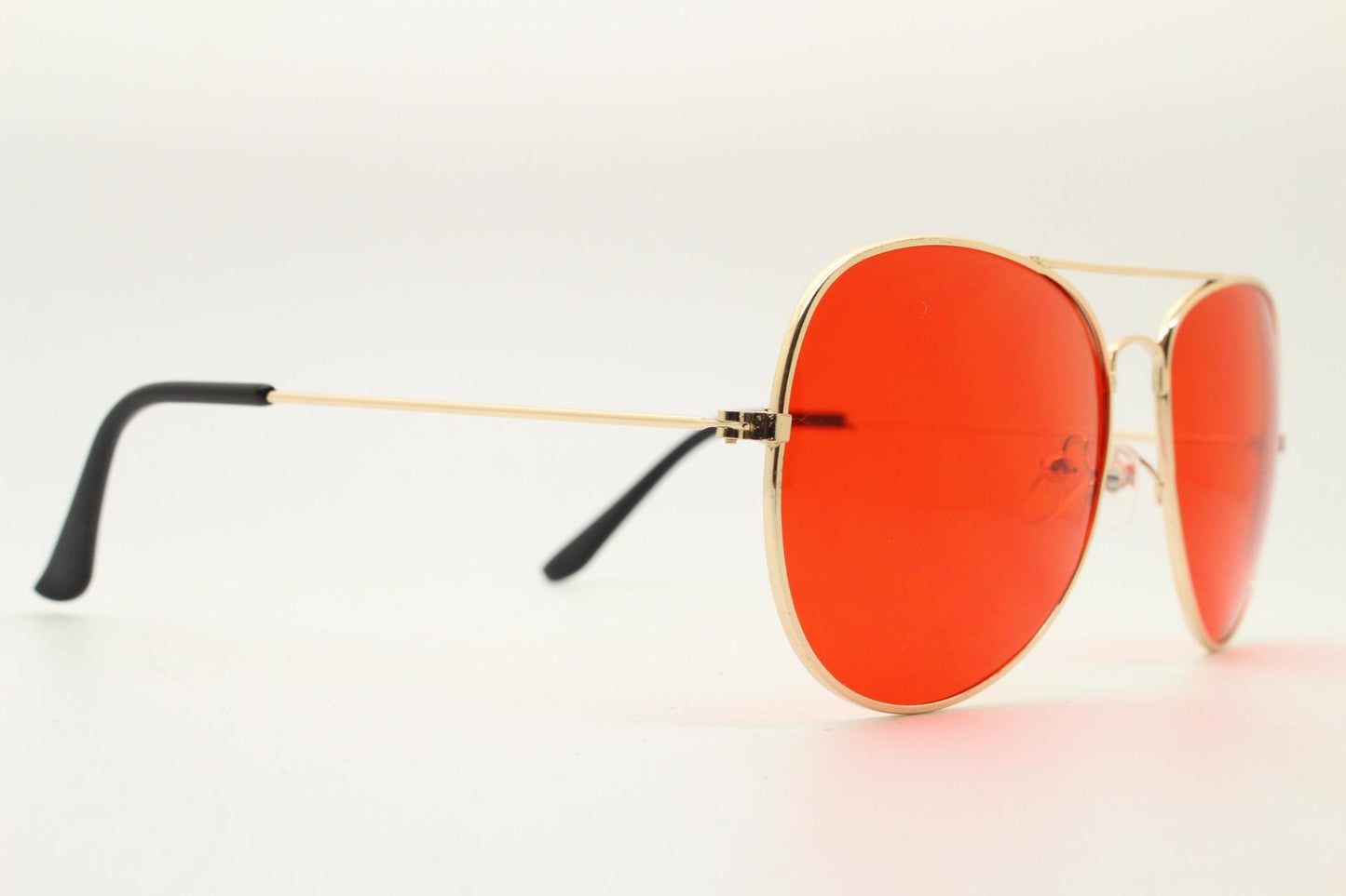 Y2K vintage teardrop aviator sunglasses. Gold chrome metal frame 70s design aviators with intense red lenses. 2000s. Unused NOS