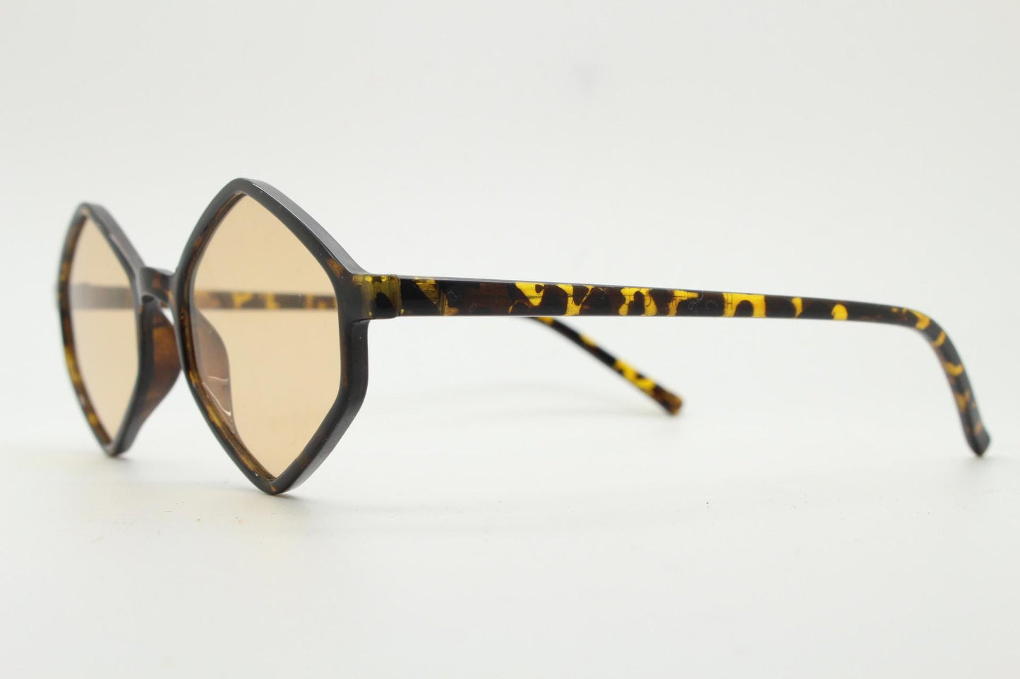 90s vintage diamond hexagon sunglasses. Atmospheric 6 sided tortoise gloss frame with very light tone brown lenses. Unused NOS