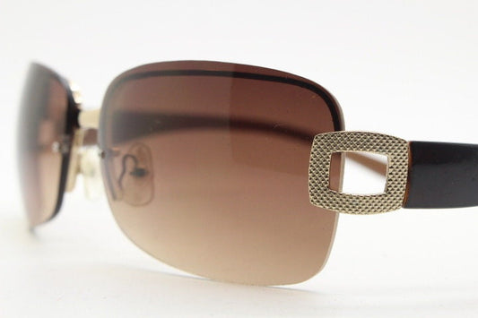 Y2K vintage rectangular brown sunglasses. Gold half frame 2000's wrap around with curved lenses, gold trim and temple crests. Unused NOS