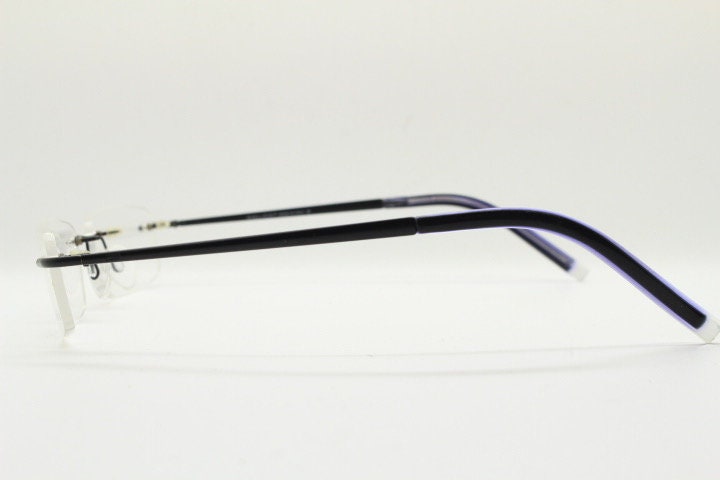 Police 90s vintage rectangular frameless eye glasses made in Italy. Minimal low profile optical frame with black satin metal trim. RX