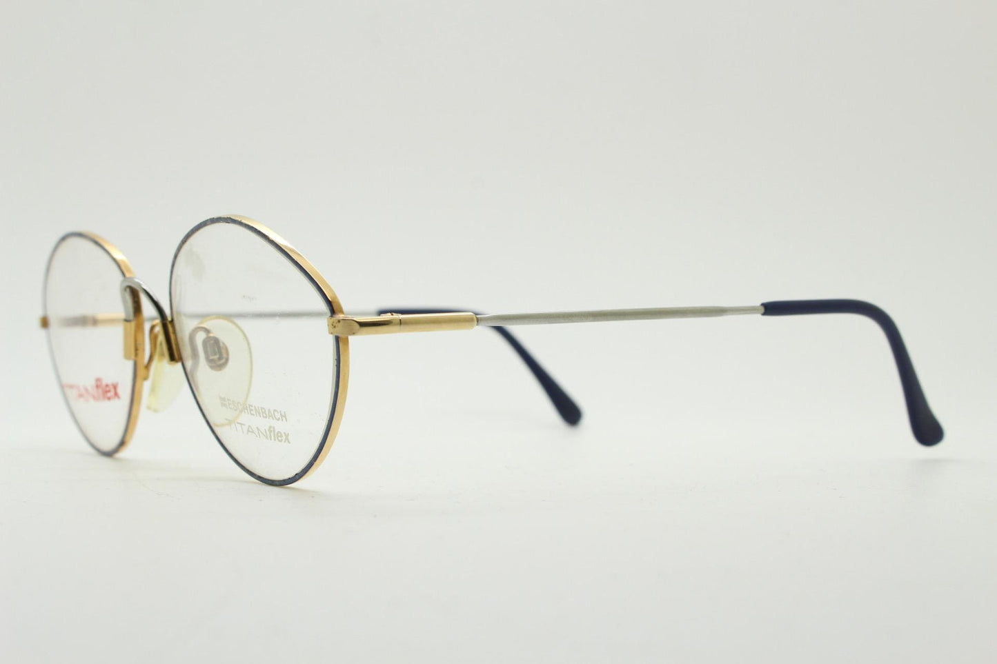 Eschenbach 90s vintage oval eye glasses made in Germany. Titanium optical frame with tasteful purple marbled front. Prescription NOS