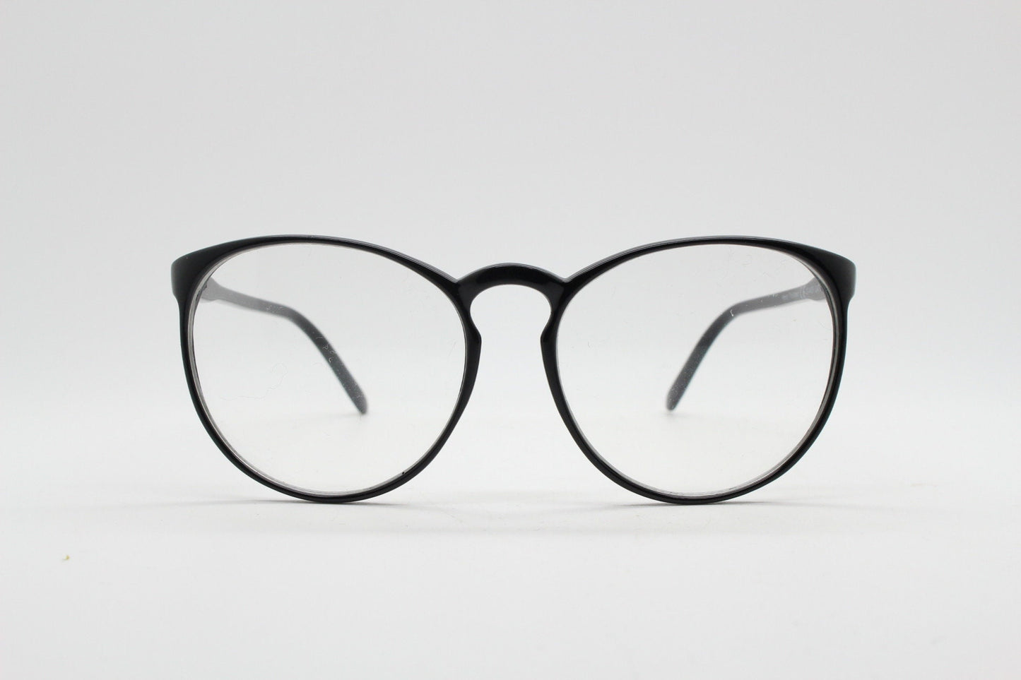 80s vintage black round glasses. Slightly oversized slim optical frames. Prescription eyeglasses with clear lens. RX spectacles