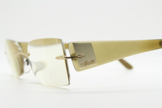 Silhouette rectangular frameless eye glasses model 7599 made in Austria. Minimal optical frame with transparent brown arms. Prescription RX