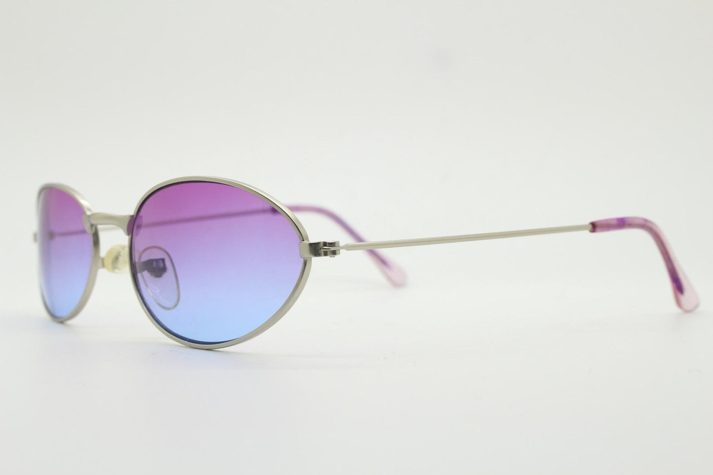 90s vintage small bug eye oval sunglasses. Silver satin frame with impressive pink to blue ombre graduating lenses. Y2K. 2000s. Unworn NOS