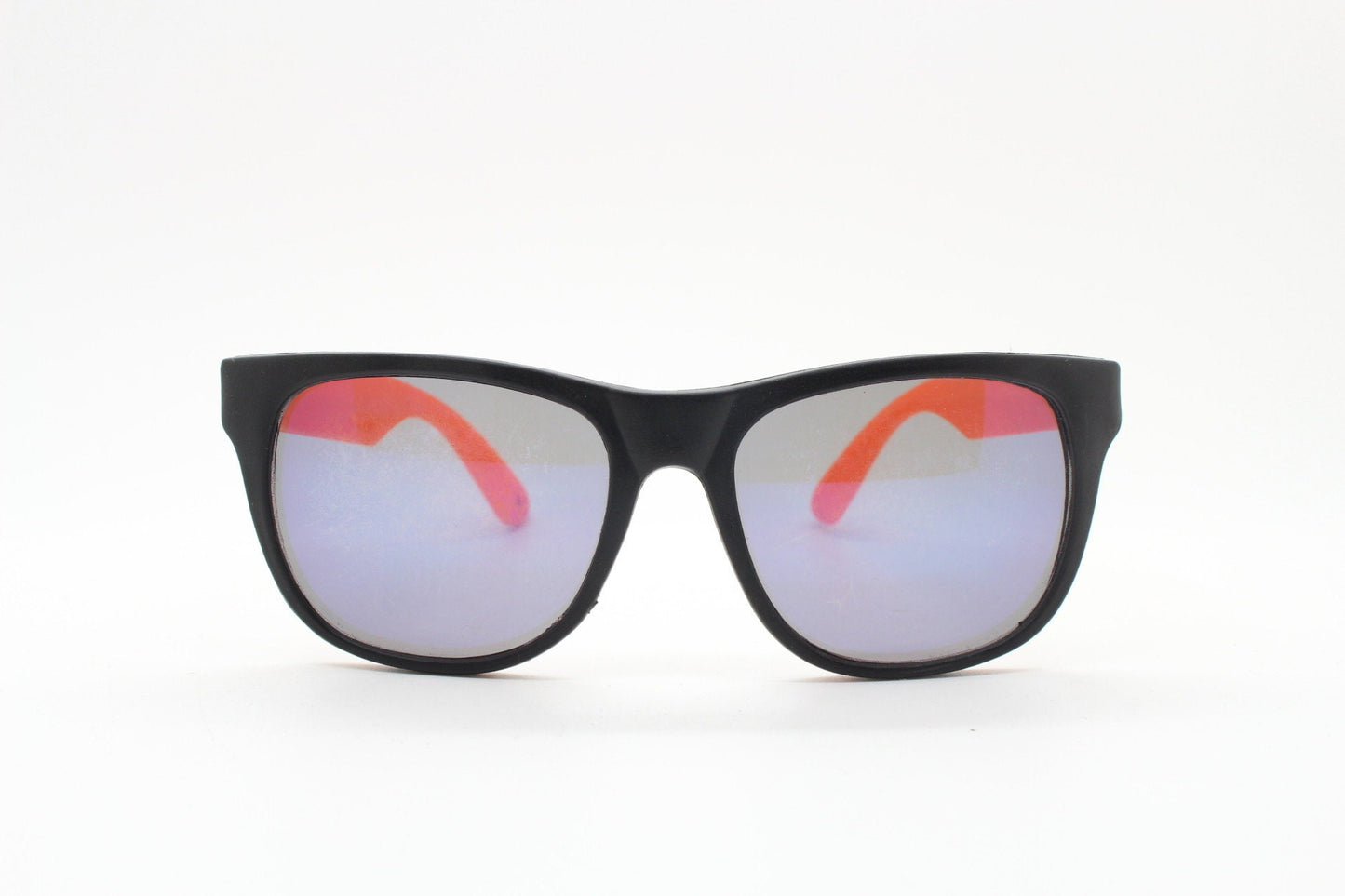80s vintage 2 tone wayfarer style sunglasses. Matt black flexible rubber frame with orange dayglo arms. Unused NOS. Y2K fluorescent rave