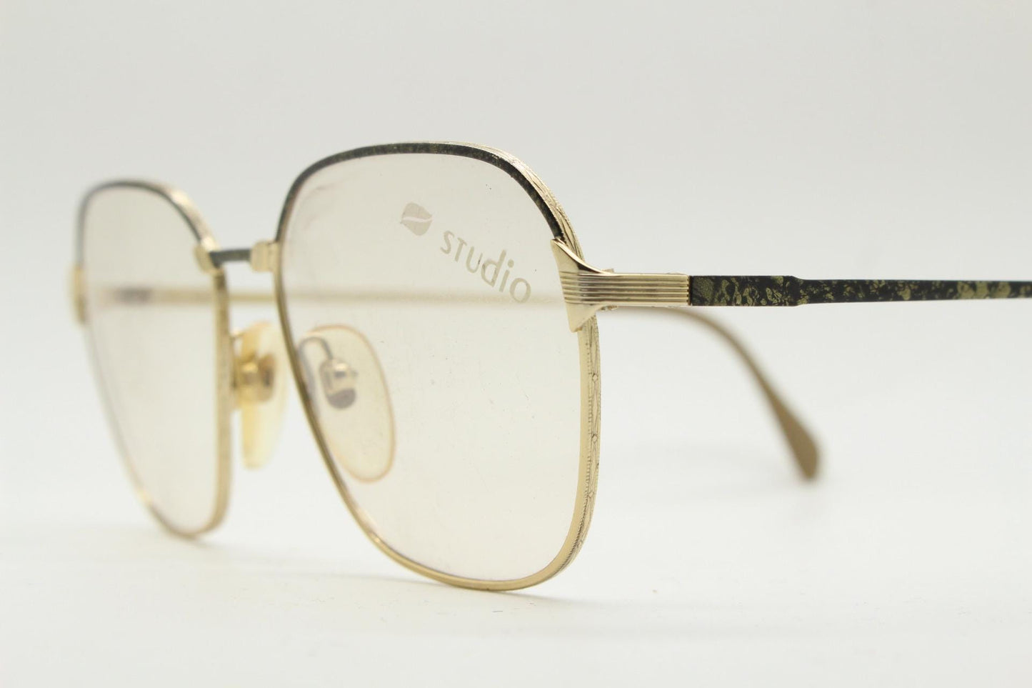 80s vintage square eye glasses made in Italy by Studio. Black and gold patterned metal optical frames in neat proportions. Unused NOS