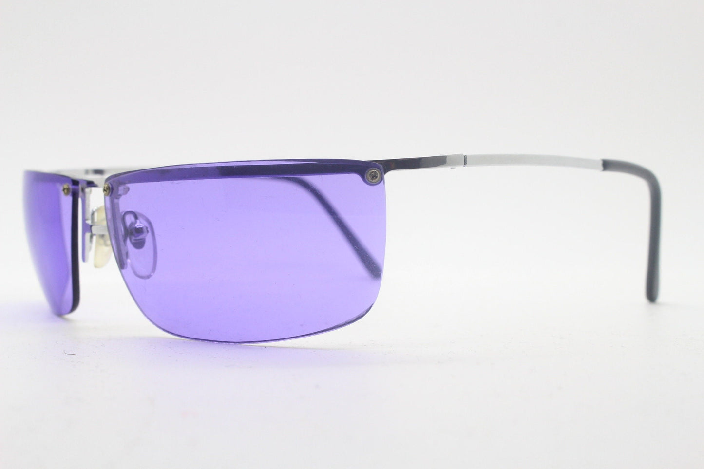Y2K vintage purple shield sunglasses. 2000's half frame wraparound aerodynamic mini mask visor with curving lenses. 90s 00s unused NOS