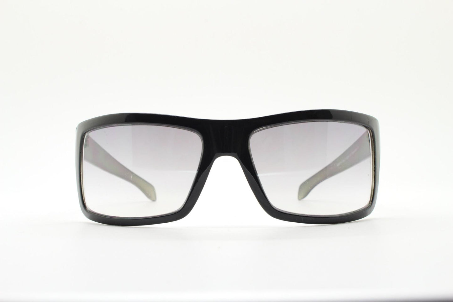 Y2k vintage wrap around large rectangular sunglasses. Curved black gloss frame with tasteful graduating lenses. 2000's NOS