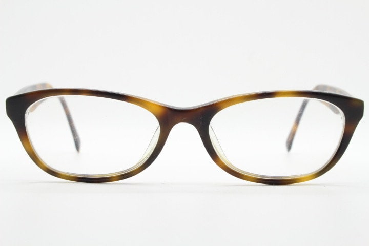 Calvin Klein Jeans modified cat eye glasses model CKJ918. Tortoise gloss low profile acetate optical frames. Prescription eyeglasses. RX