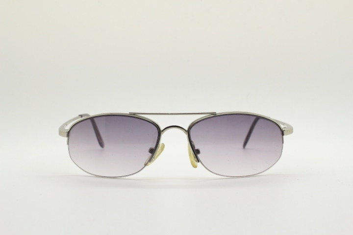 90s vintage modified extra small aviator sunglasses made in the USA. Satin finish solid metal frame aviators with light tone smoky lenses