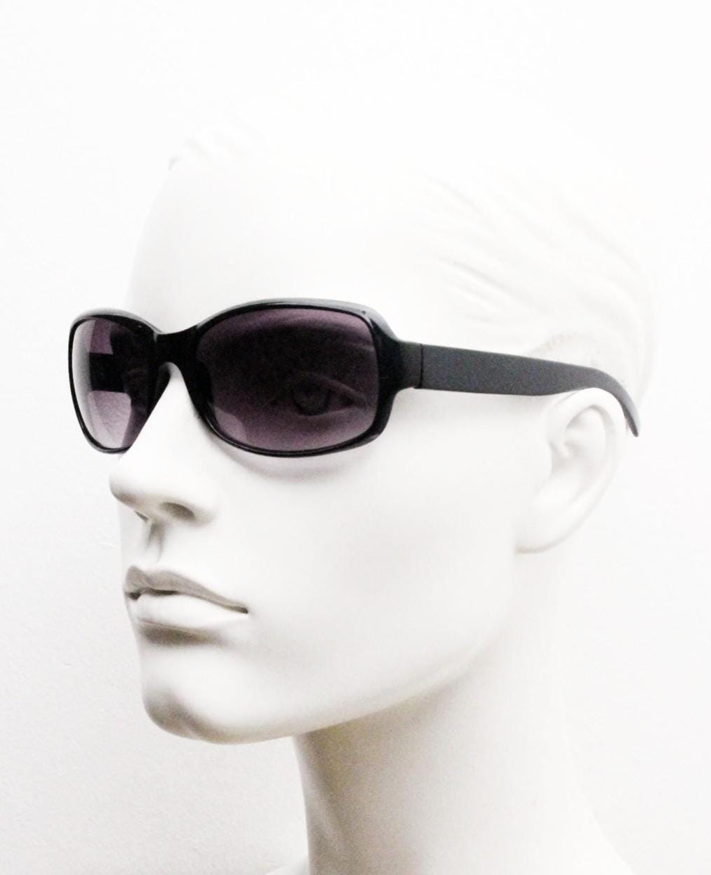 Y2K vintage curved wraparound sunglasses. Aerodynamic plain black gloss curved wrap frame. Minimal shield design. NOS