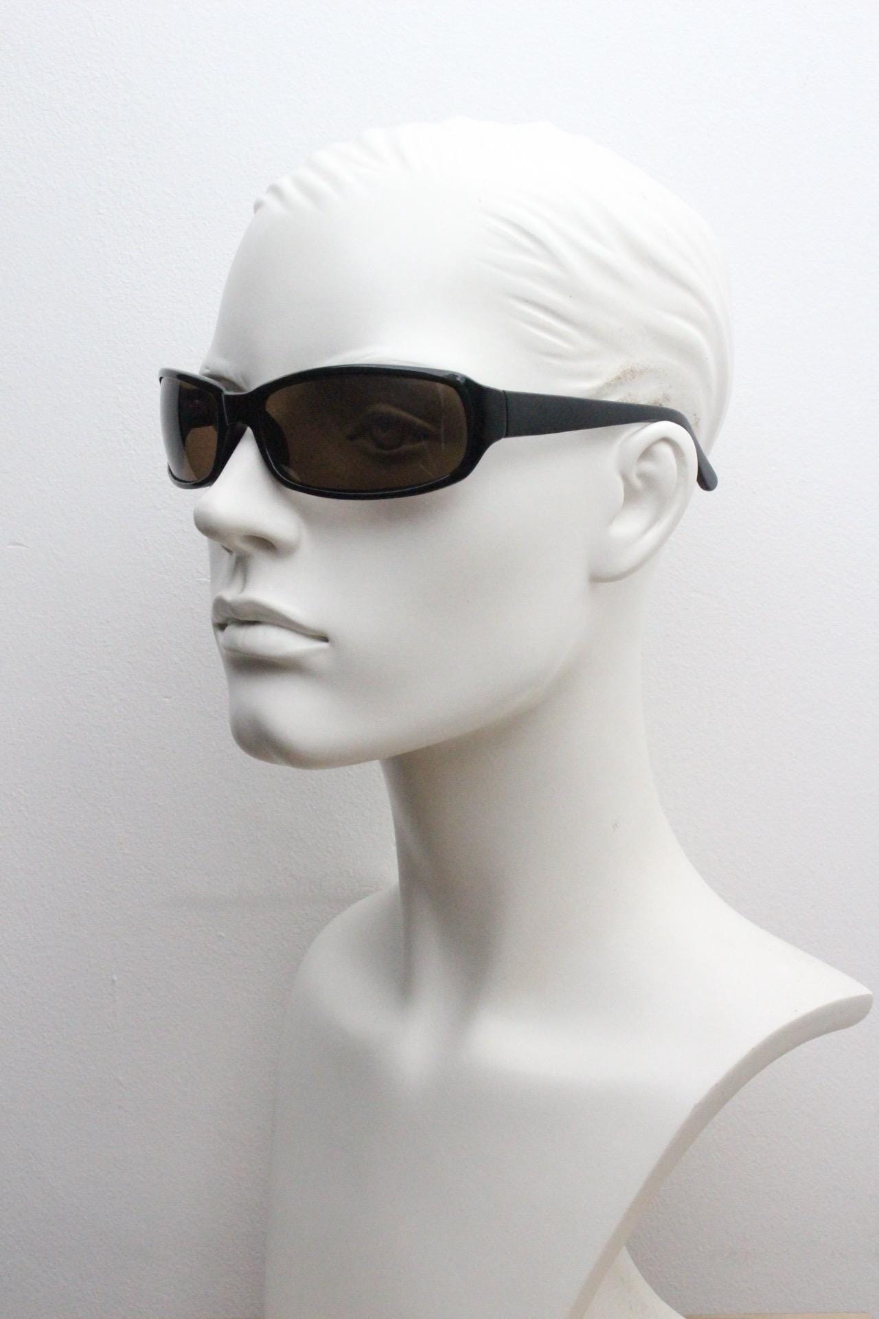 Y2k vintage wrap around rectangular sunglasses. Low profile curved black gloss frame with plain brown lenses. 2000's bug eye. NOS