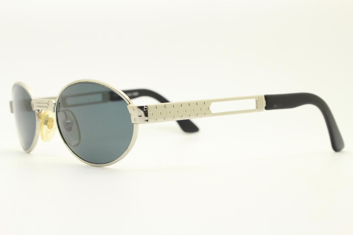 Prestige 90s vintage oval small bug eye sunglasses model 4028 made in Italy. Chrome finish solid metal frame with indented arm pattern. NOS