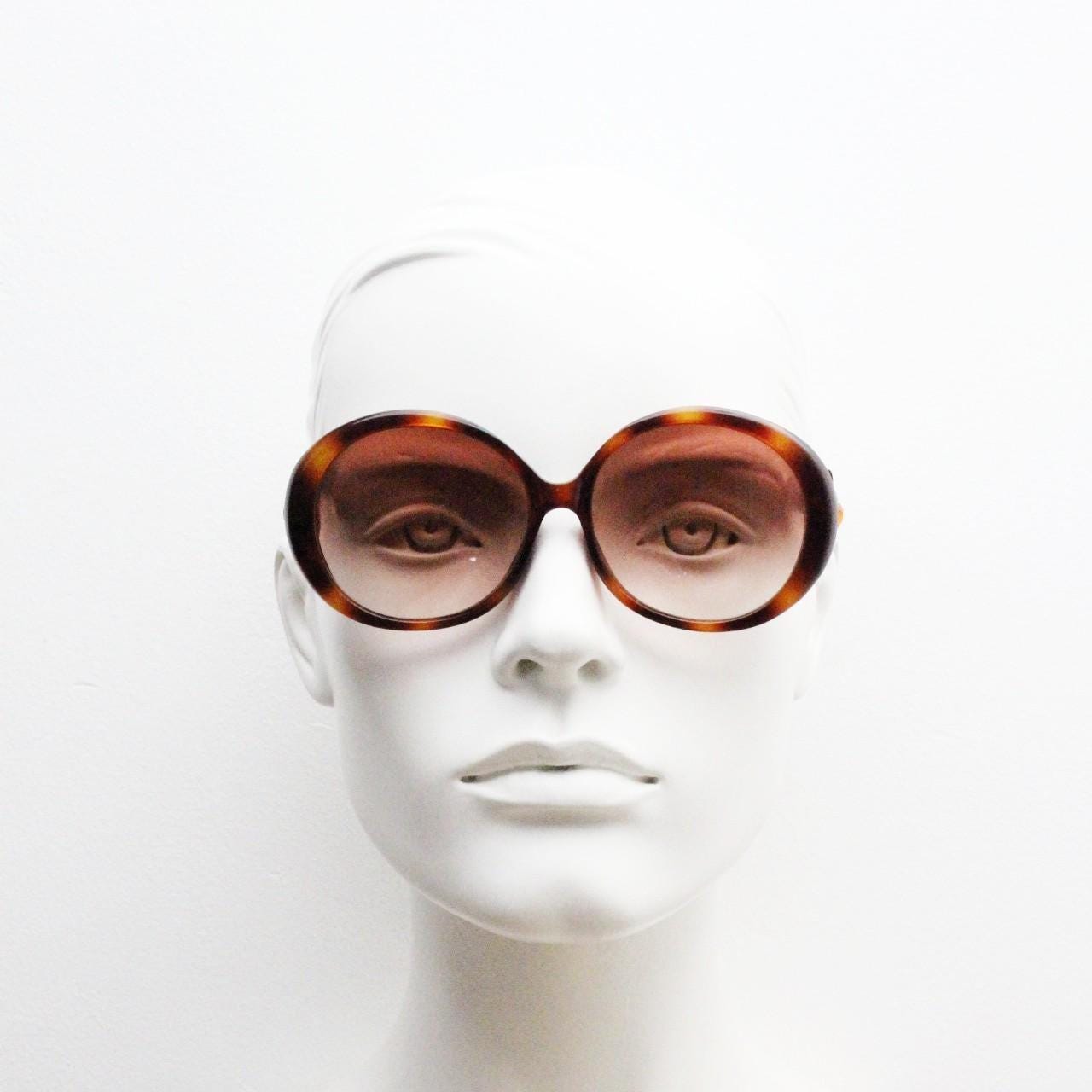 90s vintage round sunglasses. 60s style thick honey tortoise frame with graduating lenses and amber diamantes. Rhinestone. Unused NOS