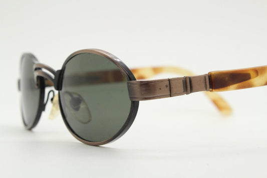 90s oval vintage metal and tortoise sunglasses. Quirky small size design with all the fashion features of their era. Unused NOS