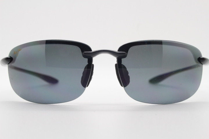 Maui Jim sport wrap around sunglasses made in Japan. Lightweight half frame shield with curving lenses. 2000's. Y2K