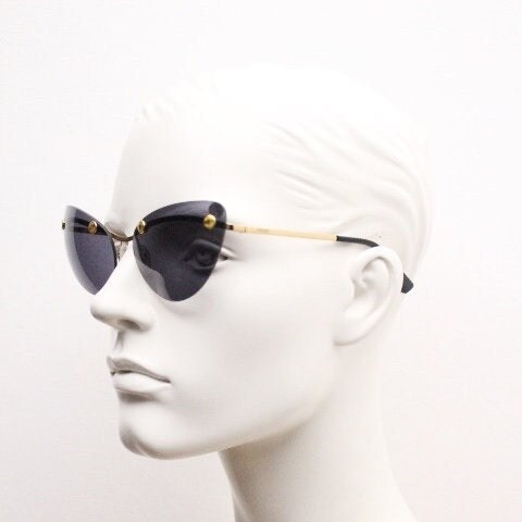 Moschino oval cat eye sunglasses model 082/S. Womens frameless cateye in perfect proportions with golden metal brow line