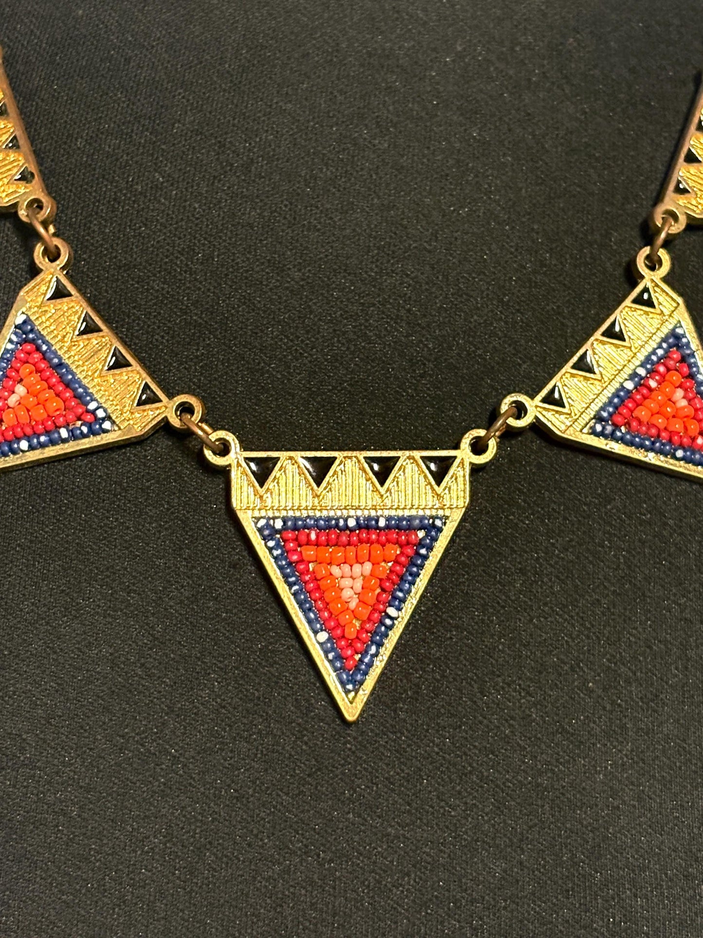 80s vintage gold triangles necklace. Aztec style with multi coloured bead inlays and ornate patterns. Womens statement design