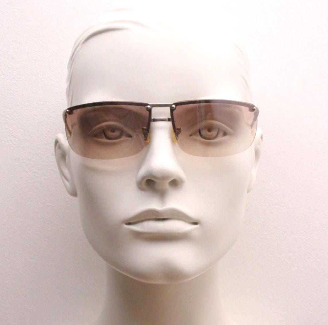Y2K vintage visor sunglasses. Flat top half frame wraparound shield design with light tone graduating curved lenses. 2000's. NOS