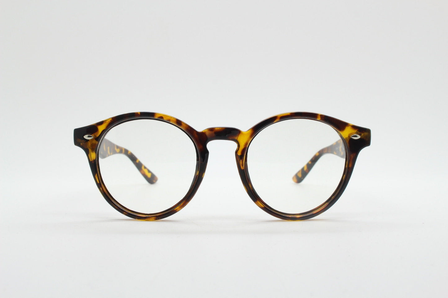 90s vintage round eye glasses. Tortoise gloss 40s design optical frame with keyhole bridge and clear lenses. Prescription RX Spectacles