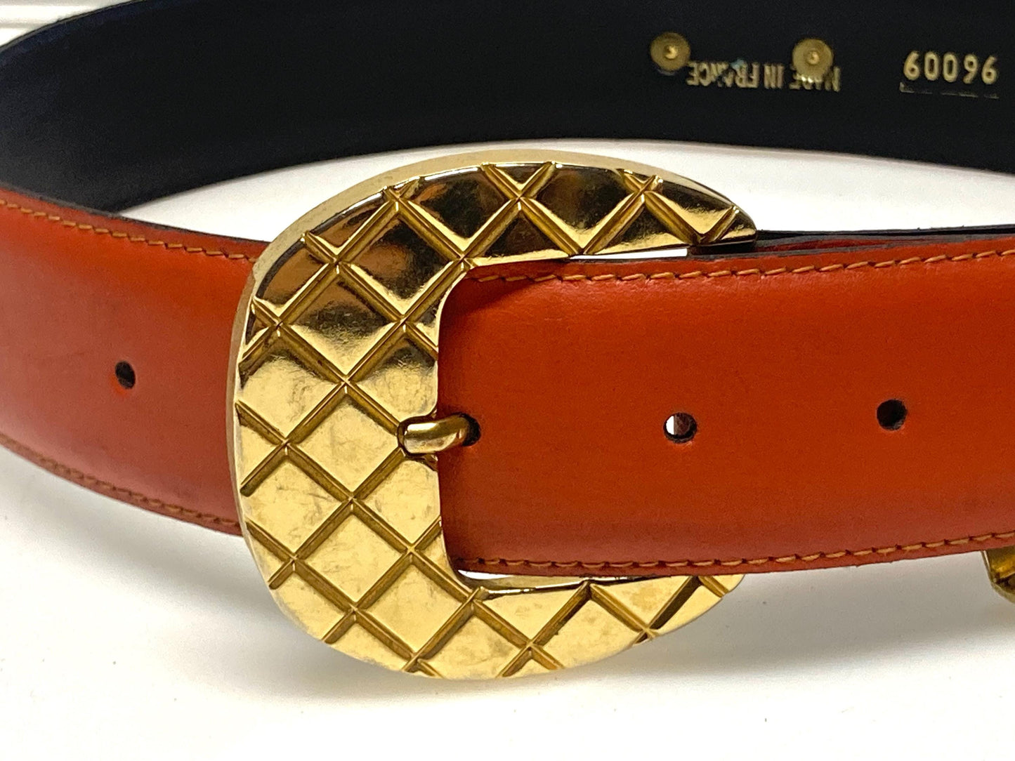 80s vintage womens dress / jeans belt in bright orange leather with golden metal squares. Made in France. Used in good condition