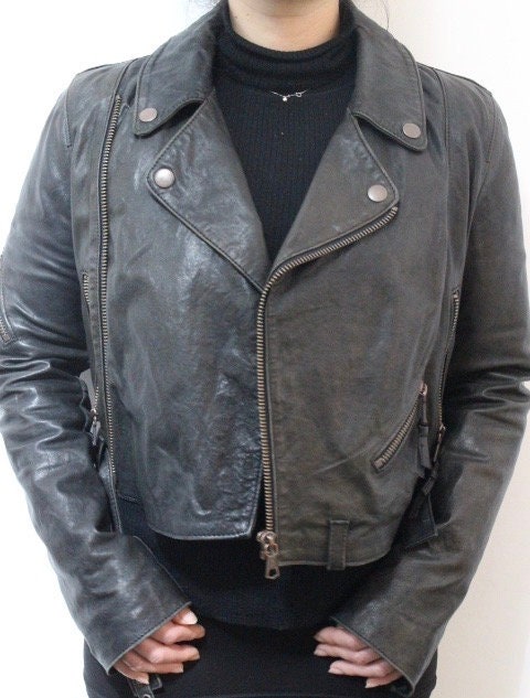 Diesel black fitted womens motorcycle jacket. Genuine leather cropped biker design with fixed adjustable belt. Over 30% sale rrp 469 GBP
