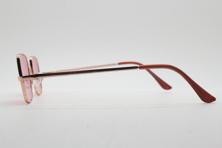 Y2K vintage small square sunglasses. Womens imposing minimal gold metal frame with pink lenses. Steampunk. Cosplay. Unused 2000s NOS