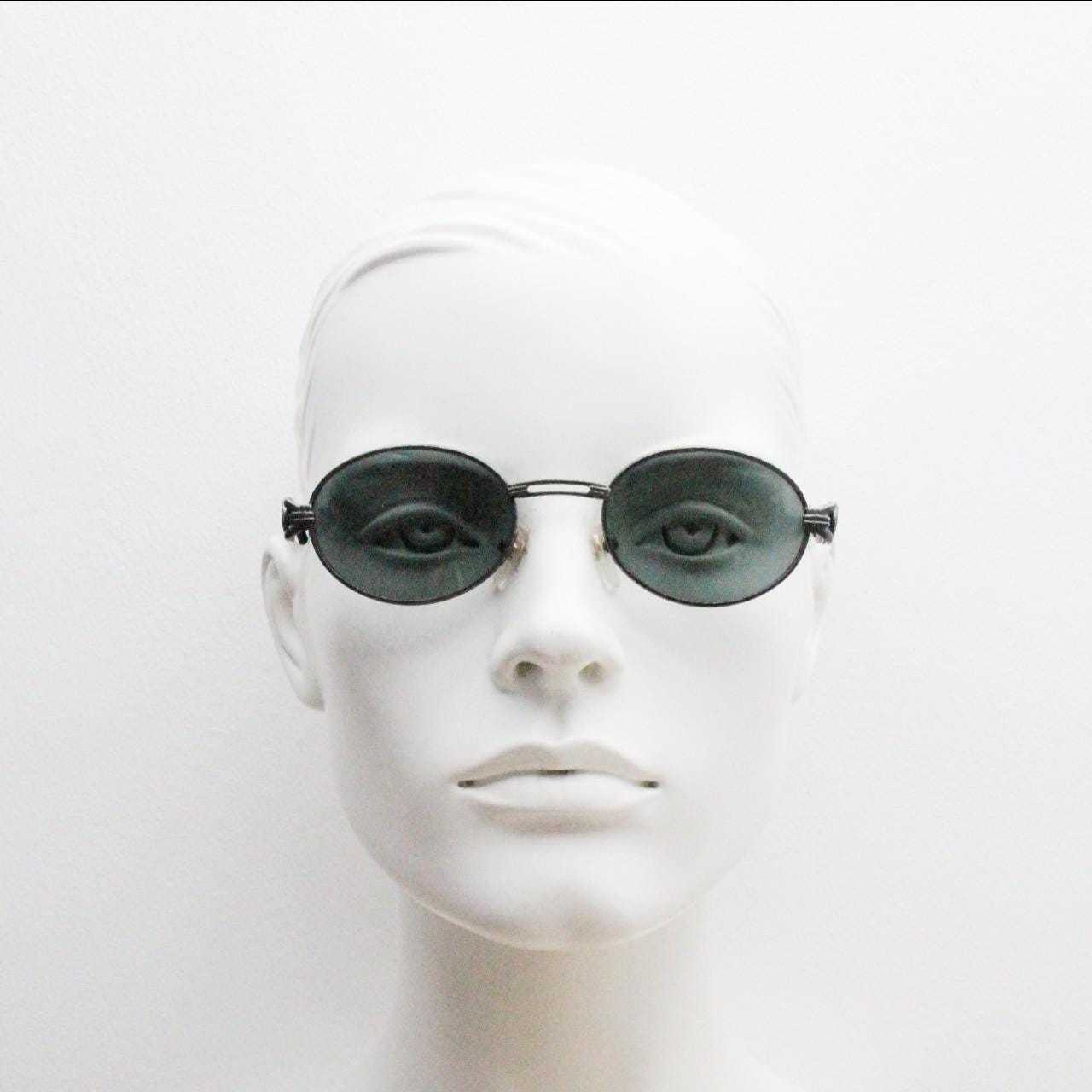 90s vintage low profile oval sunglasses. Authentic Gunmetal grey satin finish frame with chain link arm circles and real glass lenses. NOS