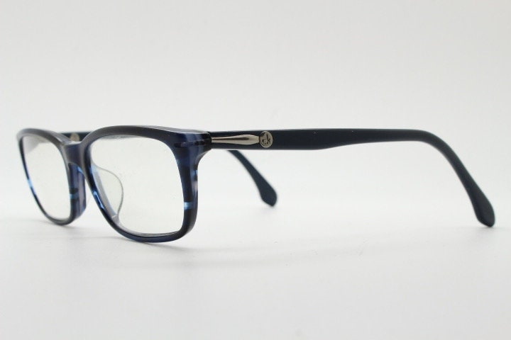 Calvin Klein rectangular low profile eye glasses. Dark navy blue gloss acetate optical frames. Prescription eyeglasses. RX