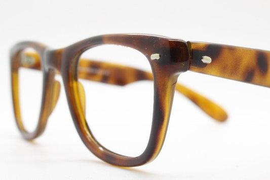 90s vintage wayfarer design eye glasses made in Italy. All time classic optical frames in mottled browns. Prescription RX eyeglasses. NOS