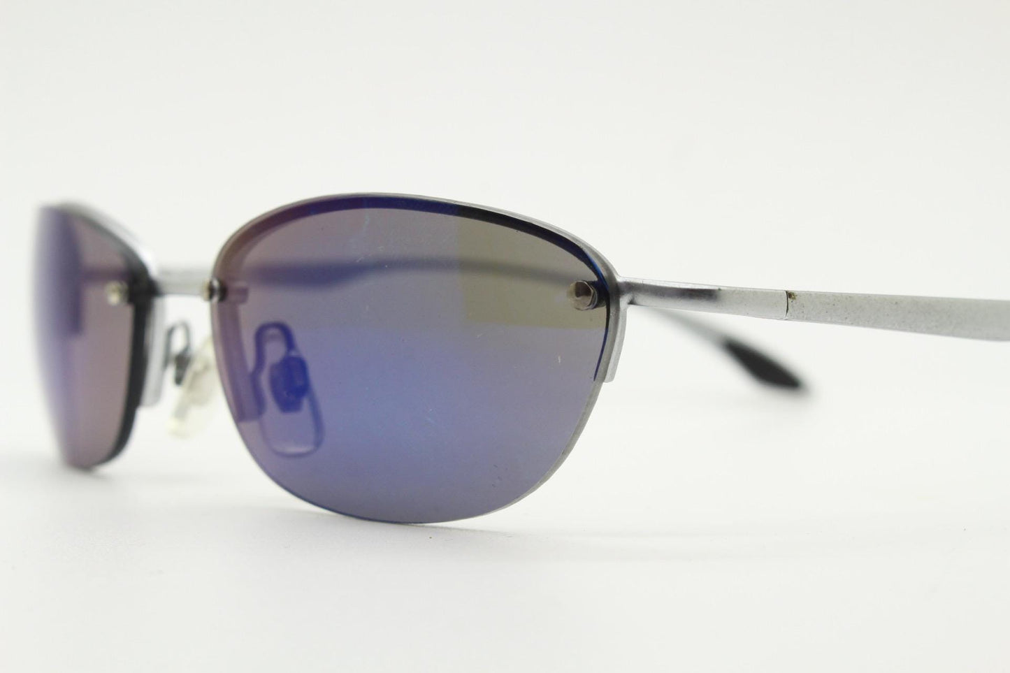 90s vintage small bug eye oval sunglasses. Minimal silver satin finish solid metal half frame with blue mirror lenses. Y2K.  NOS sample