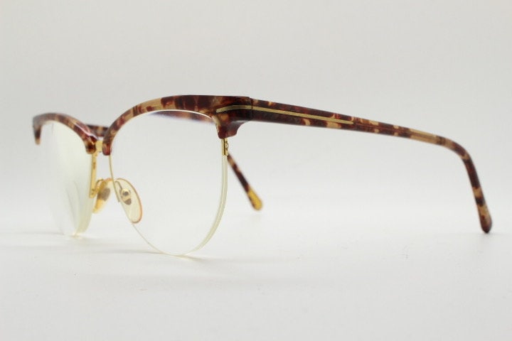 Versace 90s vintage brow line cat eye glasses made in Italy. Elegant tortoise acetate cateye optical half frames. Prescription RX eyeglasses