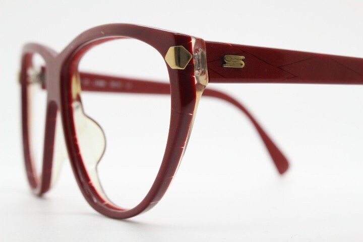 Silhouette 80s vintage oversized cat eye glasses made in Austria. Dramatic red prescription optical frame with subtle criss cross stripes RX