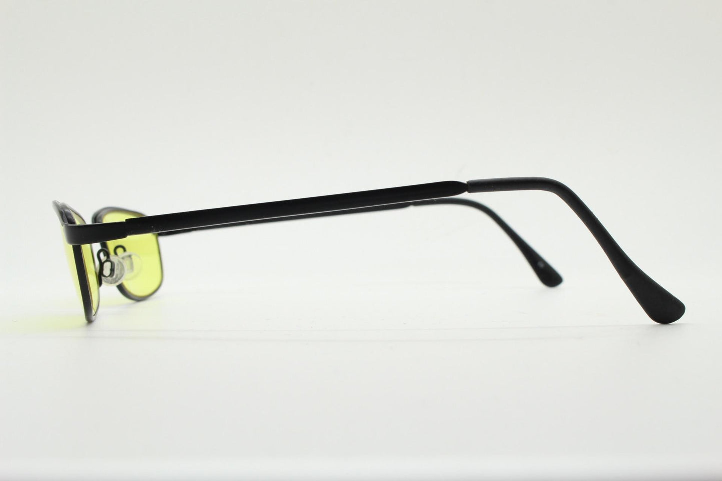 Vintage small rectangular sunglasses. Authentic quirky 90s design in a matt black solid metal frame with bright yellow lenses. 2000s. NOS