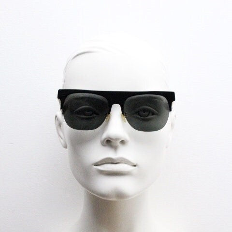 Retrosuperfuture vintage flat top half frame sunglasses hand made in Italy. Black gloss acetate front with tall golden arms