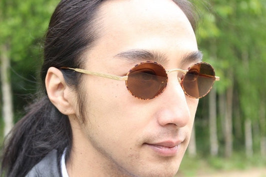 Armandos 90s vintage oval sunglasses made in Italy. Enamelled honey tortoise front with ornate tooled metal arm patterns. NOS