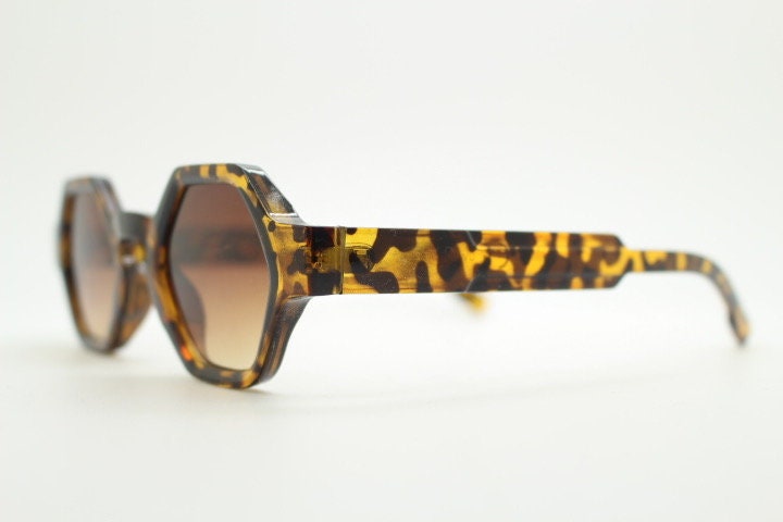 90s vintage hexagon sunglasses. 6 sided honey tortoise gloss chunky frame with graduating Havana brown lens tone. NOS