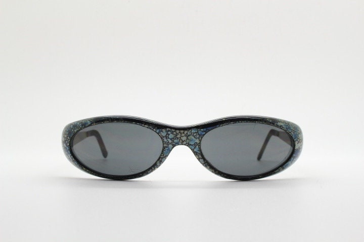 Killer Loop Shedevil 90s vintage shield sunglasses made in Italy. Low profile wrap around design with unique metallic print. One off sample
