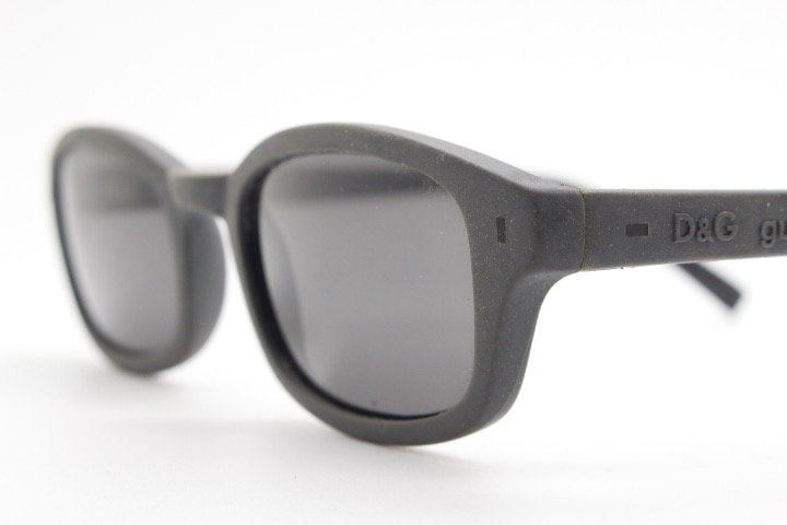 Dolce and Gabbana gum sunglasses made in Italy. Mens 90s vintage innovative flexible grey rubber frame with black lenses