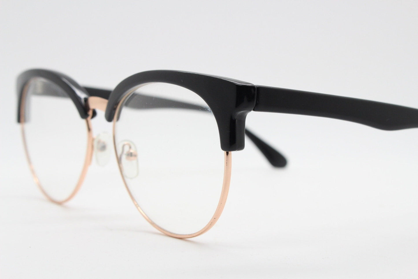 90s vintage modified cat eye glasses. Black gloss browline half frame eyeglasses with gold underwire. 50s, 60s design cateye. NOS