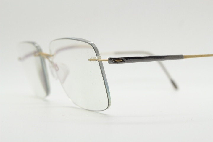 Silhouette rectangular frameless eye glasses model 7719 made in Austria. Minimal lightweight titanium optical frame. Prescription RX