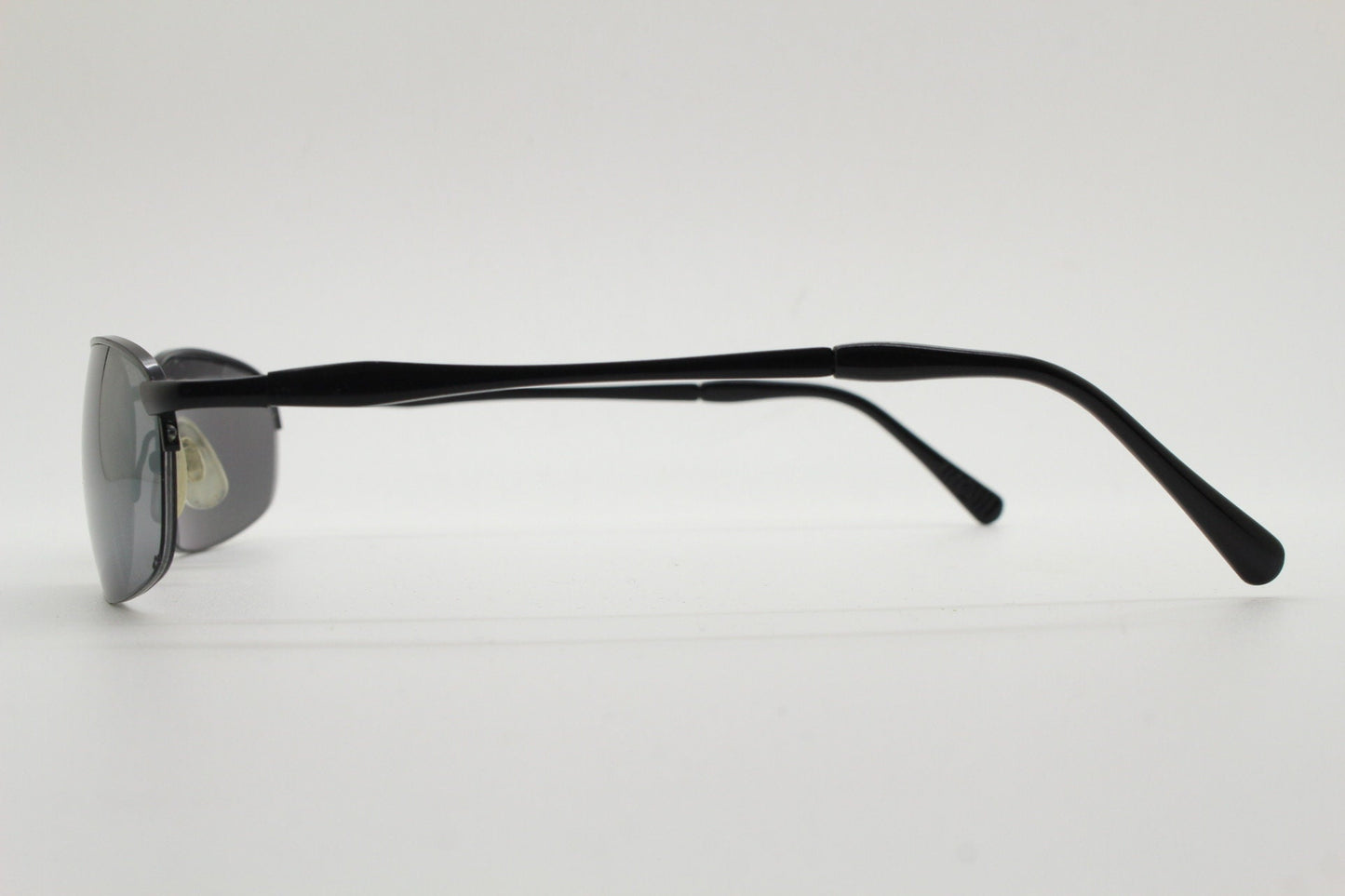 90s vintage small oval black sunglasses. Satin finish half frame with grey lenses and slight mirror glaze. 2000's. Y2K. Unused NOS