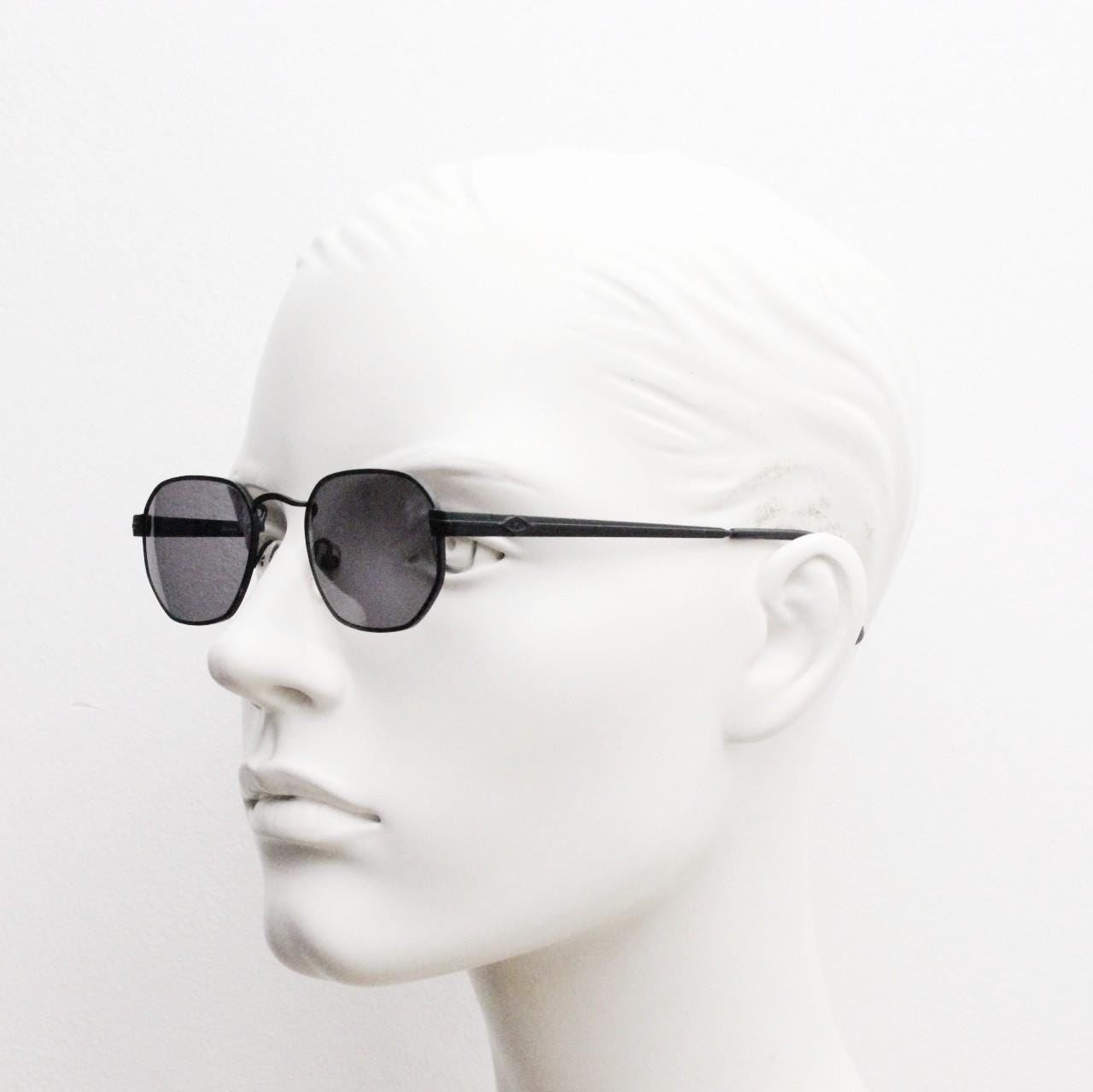 Prestige 90s vintage small oval sunglasses model 119 made in Italy. Black matt metal frame with with subtle angular facets, NOS octagon