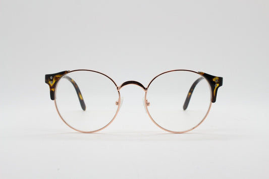 90s vintage modified cat eye glasses. Tortoise arms with a round gold face. 40s, 50s style clear lens eyeglasses. Cateye