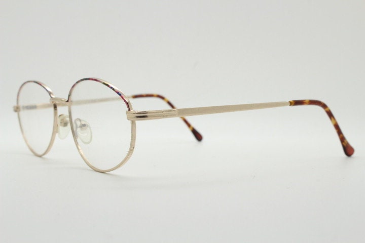90s vintage oval eye glasses. Bright golden optical frames with coloured enamel brows. Prescription RX spectacles. Clear lens NOS