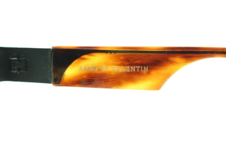 Anne et Valentin rectangular eye glasses hand made in France. Black matt titanium optical frame with mottled brown acetate. Prescription RX
