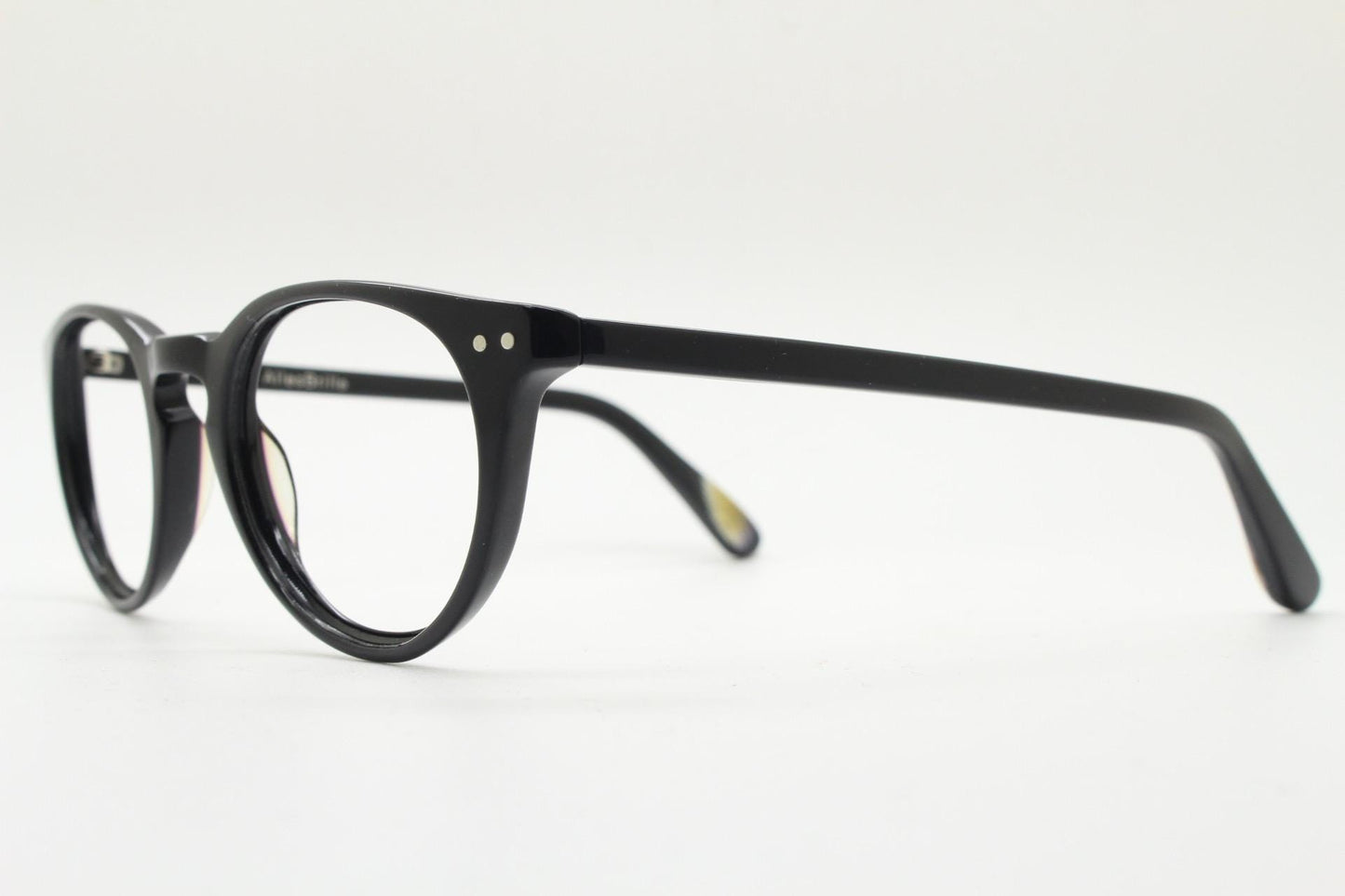 90s vintage oval eye glasses by Alles Brille of Germany. Classical black gloss acetate optical frames with keyhole bridge. RX Spectacles